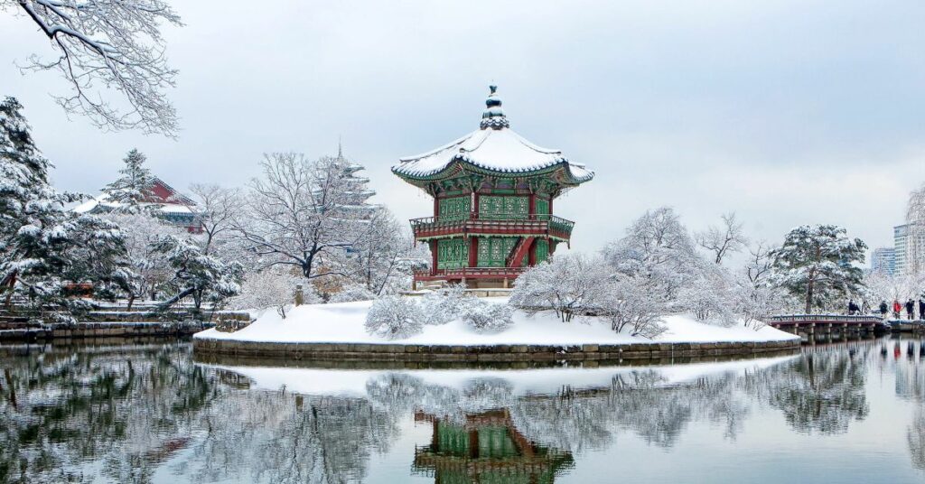 Korean palace grounds in winter with snowy scenes